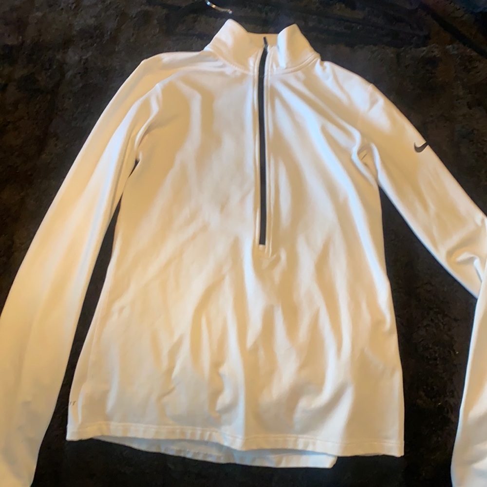 Womens Nike dri fit top. Stylish with half way zipper in front warm inside.